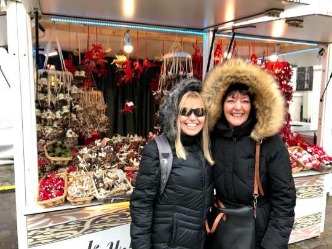 Nighttime panorama of Basel Christmas market with illuminated cathedral – end point of Amsterdam to Basel river cruise